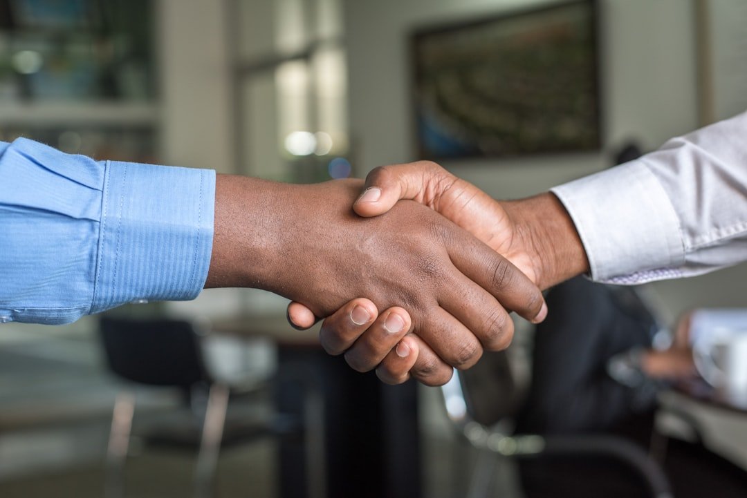 two-people-shaking-hands-n95vmlxqm2i